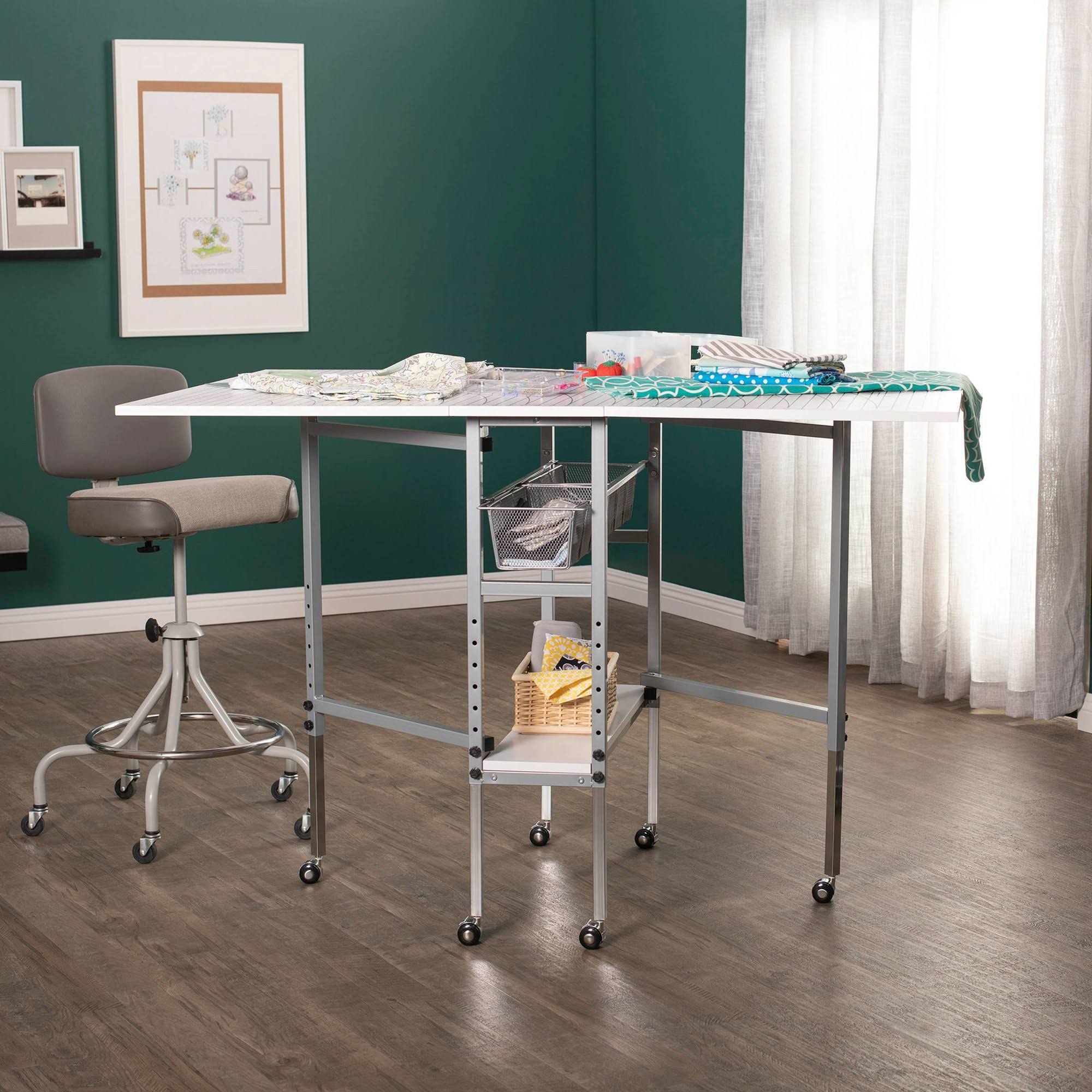 Sew Ready Mobile Folding Height Adjustable Quilting Fabric Cutting Table with Sewing Board Grid and Storage in Silver/White Top - Image 4